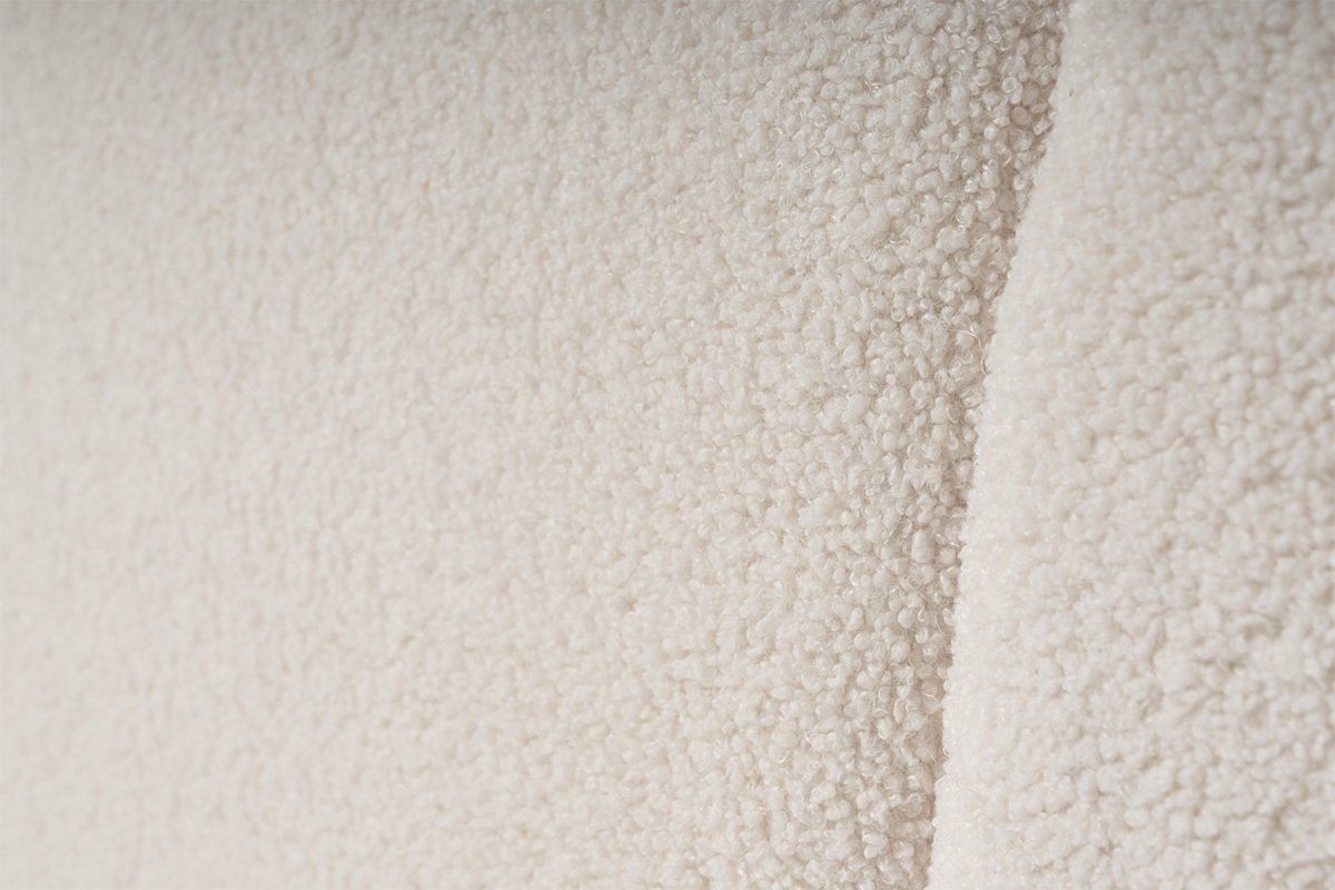 Gros plan du tissu laine boucl�e du lit coffre 160x200 cm.